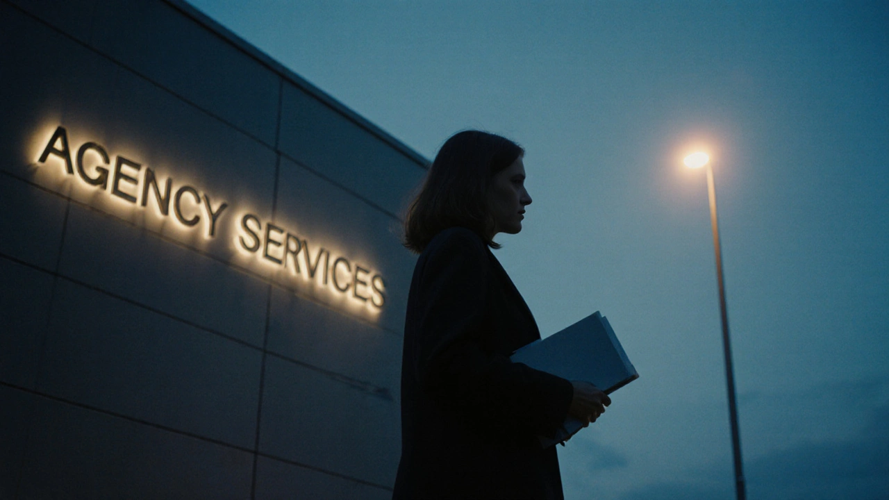 Woman walking away from an agency building at dusk, holding a notebook, exuding quiet confidence.